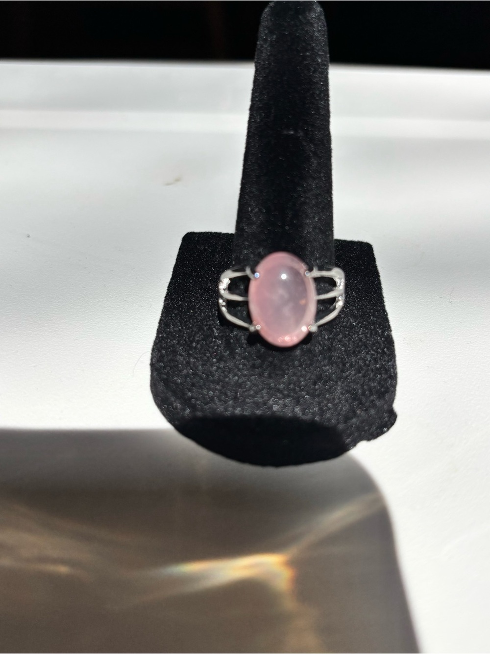 Pink Oval Stone Ring with silvery band with 3 slit design. Size 8